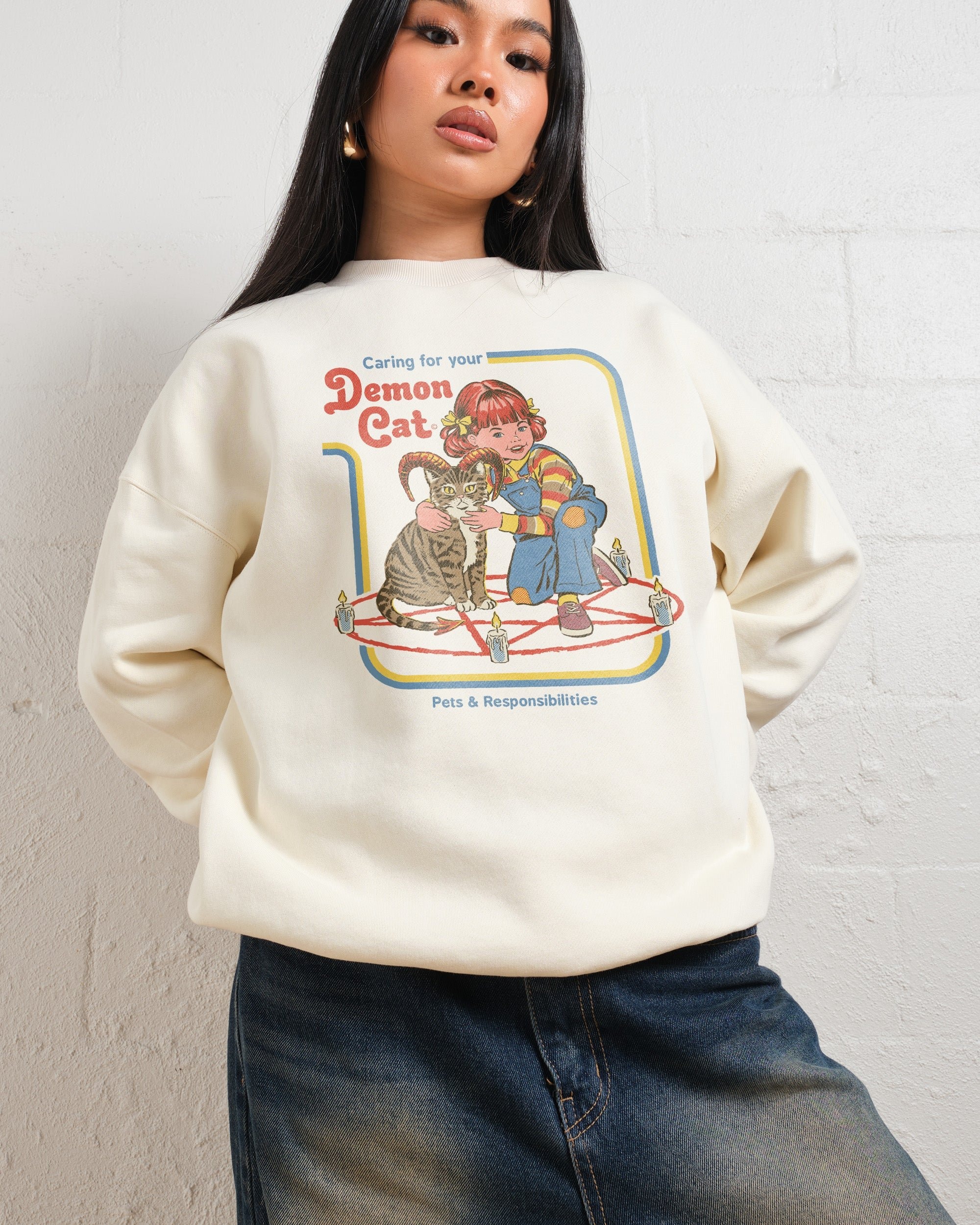 Caring for Your Demon Cat Sweatshirt by Steven Rhodes Unisex Graphic