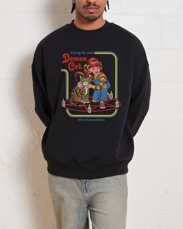 Caring for Your Demon Cat Sweatshirt by Steven Rhodes Unisex Graphic